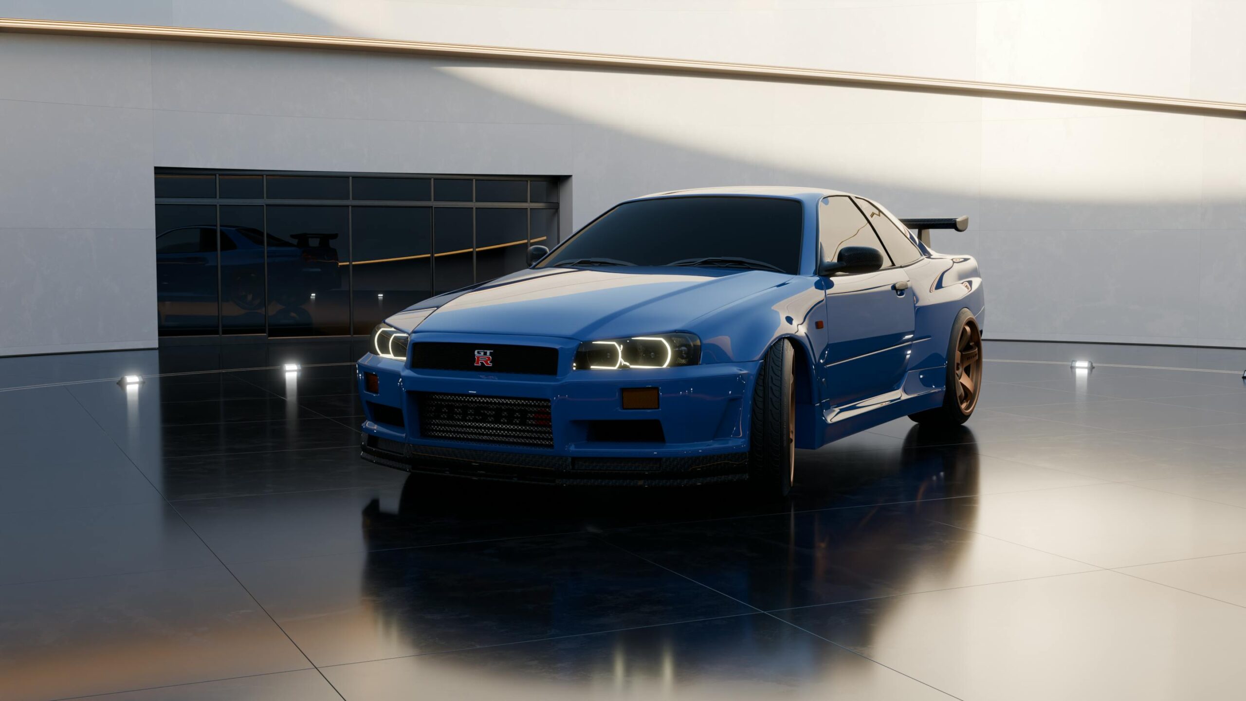 Blue Nissan Skyline R34 parked in a sleek indoor showroom setting.